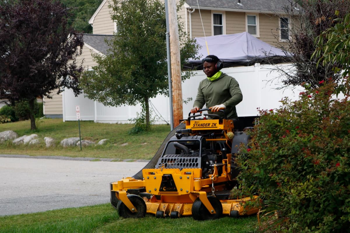 Mowing a front yard along the street