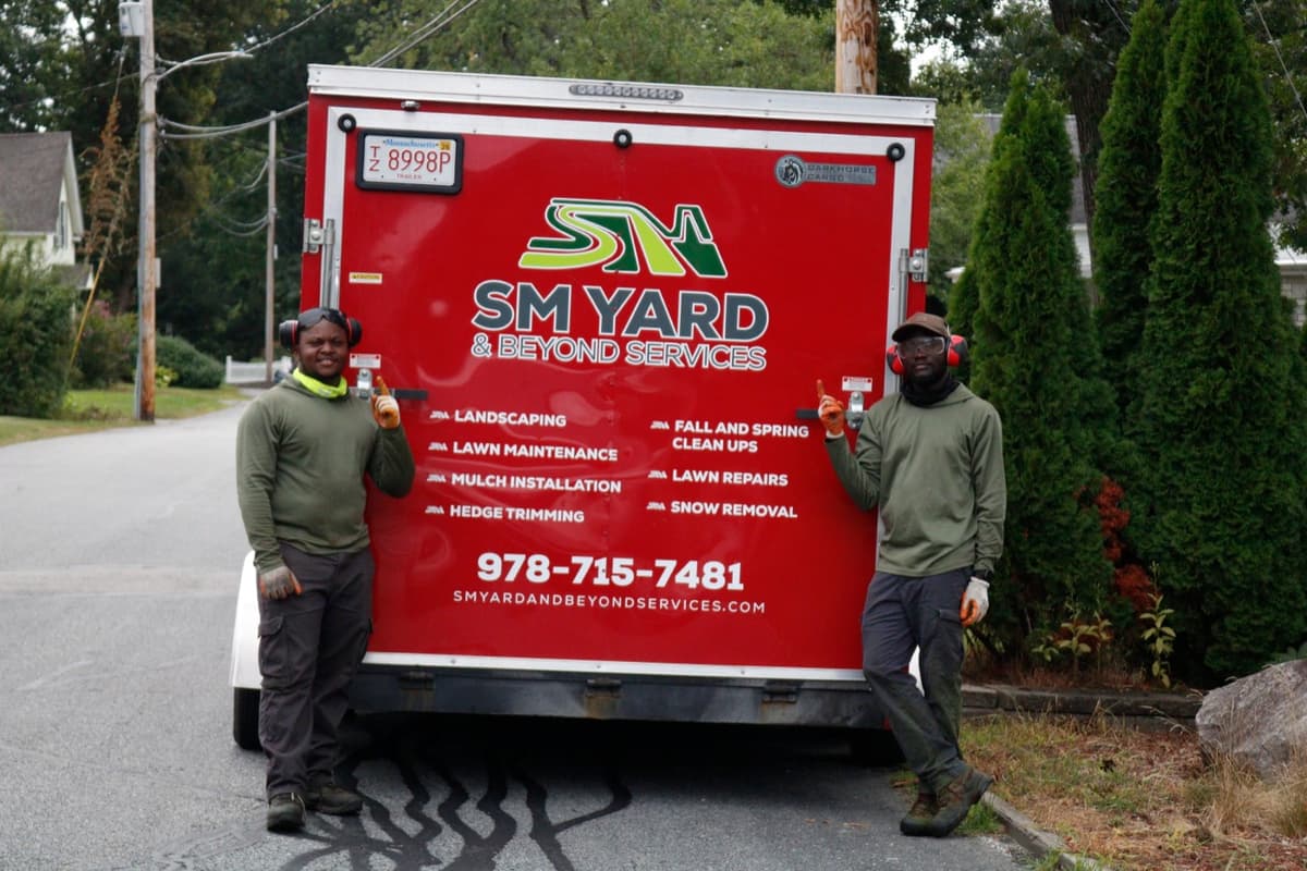 Elijah and Timothy, the SM Yard and Beyond crew, at their equipment trailer