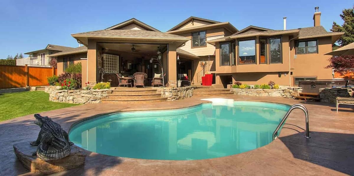 A landscaped backyard with stonework and fresh lawn